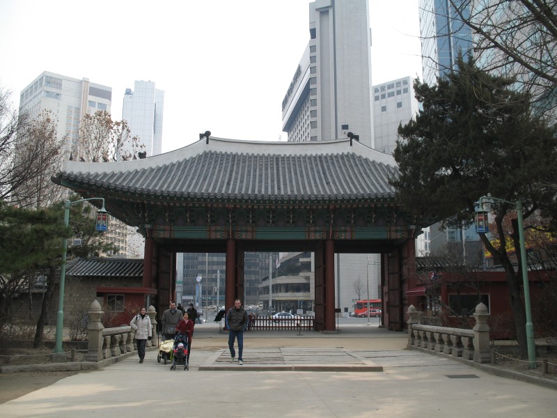 Palace gate, with Seoul urban background