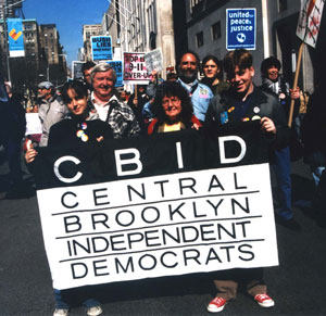 [CBID marchers with
banner]