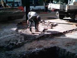 A workman removing
the old bricks