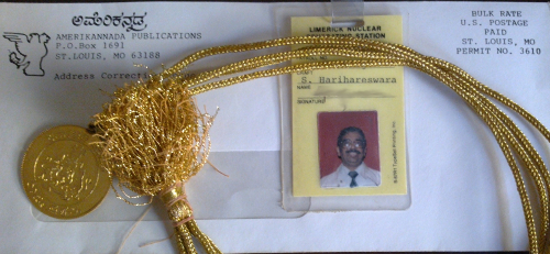 An Amerikannada envelope, my dad's employee badge at a nuclear power station, and the Rajyotsava award he received for service to the Kannada language