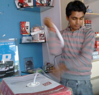 Rakesh spinning a coil of CAT-5 around his arm