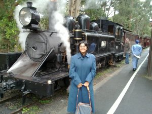 Sumana in front of a steam engine